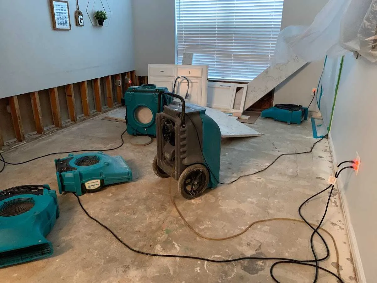 Dehumidifier in flood-cut room for Water Damage Restoration in Rowley